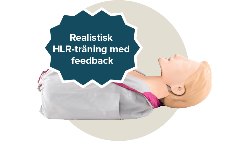 Little Anne docka QCPR från Leardals. Dockan har en lila och grå jacka. Etikett: Realistisk HLR-träning med feedback