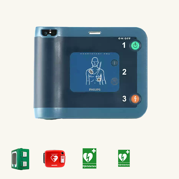 Philips FRx hjärtstartare i ett hjärtstartarpaket med ett grönt skåp, en röd väska samt gröna skyltar. 