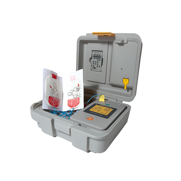 Övningshjärtstartare AED 3 i en stor grå väska med vita och röda elektroder. 